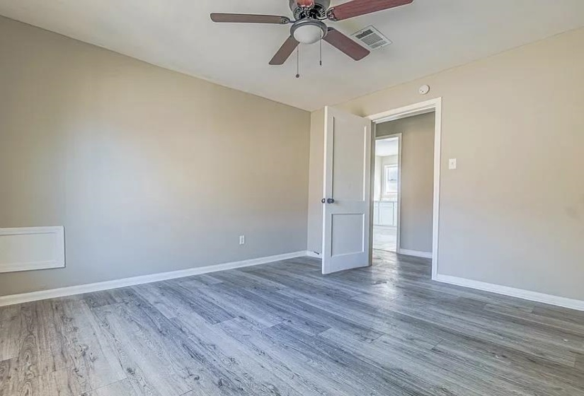 Spare room featuring wood finished floors and ceiling fan