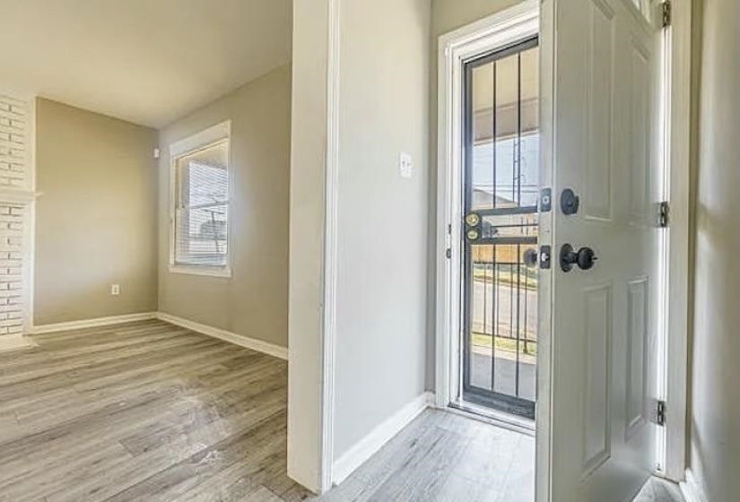 Entryway featuring light wood finished floors and baseboards