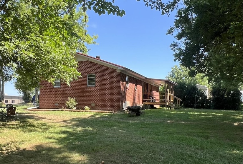 View of side of property with a yard