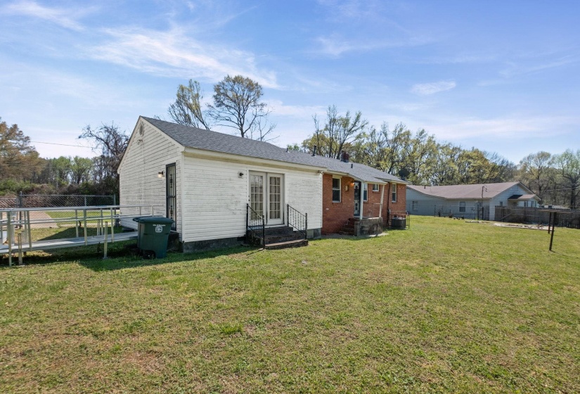 Back of property with entry steps