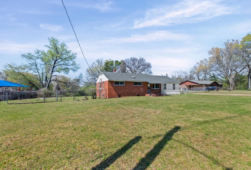 Front view of house with crawl space and brick siding