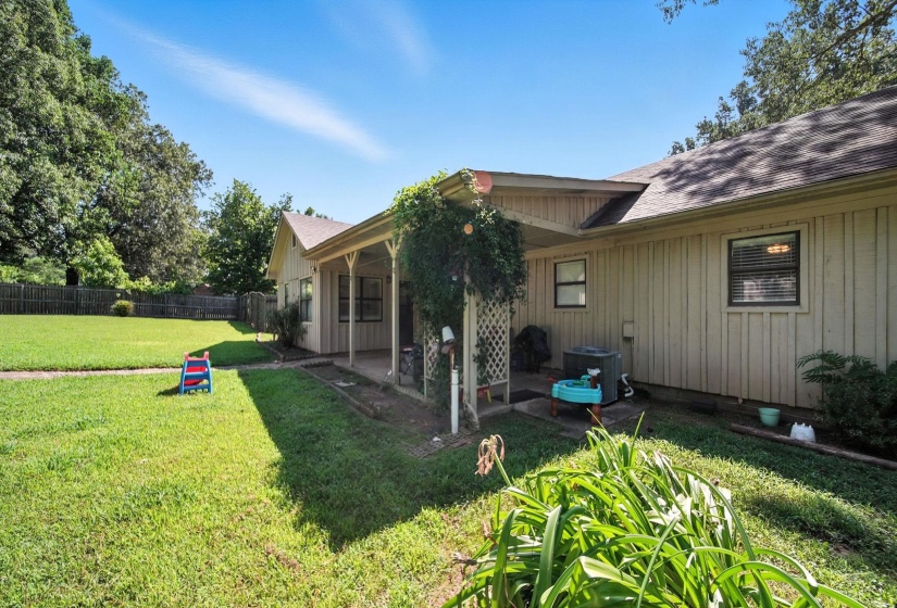 Fenced backyard featuring a patio area