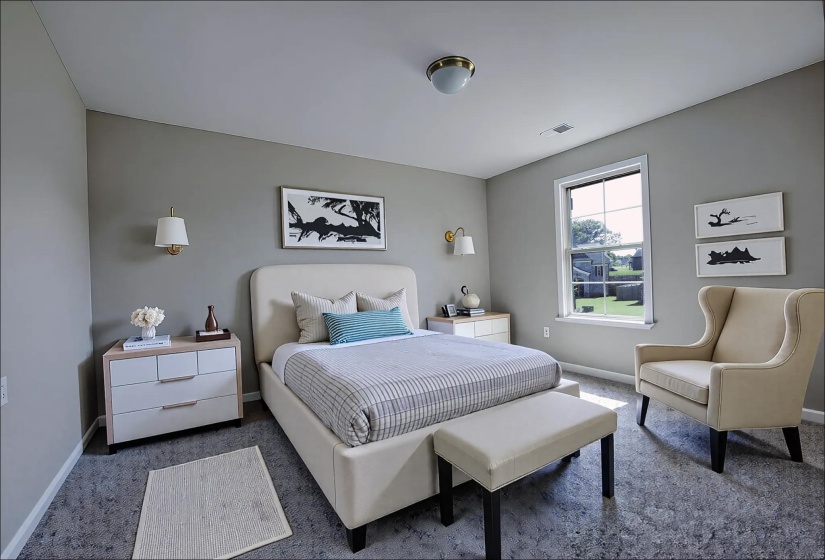 Carpeted bedroom with baseboards