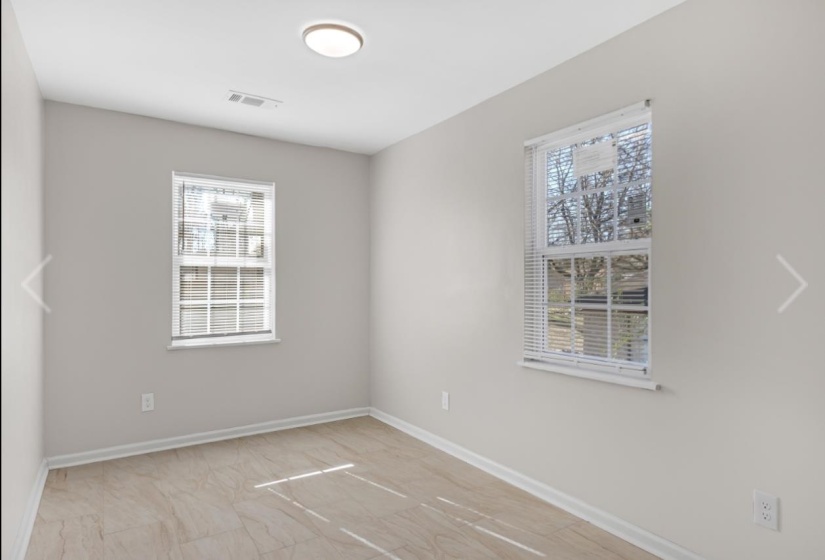 Unfurnished room with baseboards