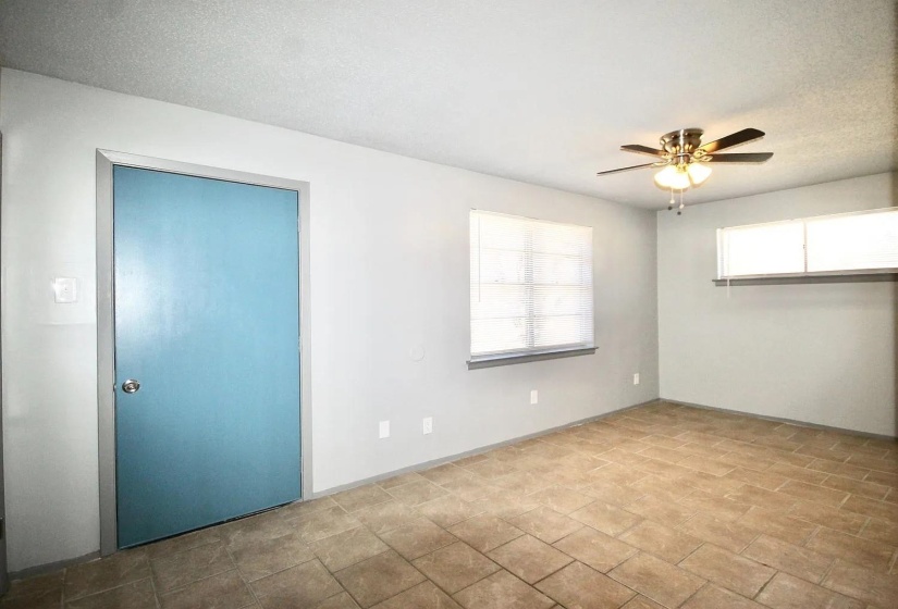 Empty room featuring a ceiling fan