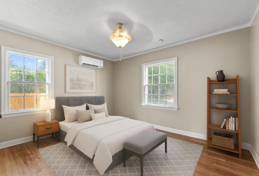 Rest easy in the primary bedroom featuring ornamental molding, hardwood floors, cooling ceiling fan, closet, and fresh neutral paint. The photo has been virtually staged.