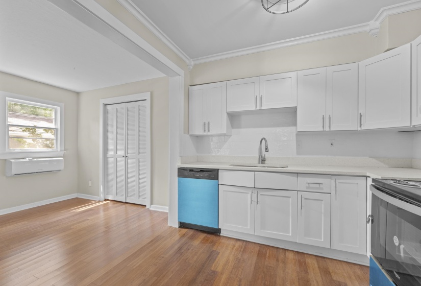 Cooking will be a delight in this updated kitchen with new cabinets, backsplash, granite and appliances.