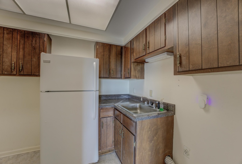 The second kitchen has a refrigerator, sink and pantry.