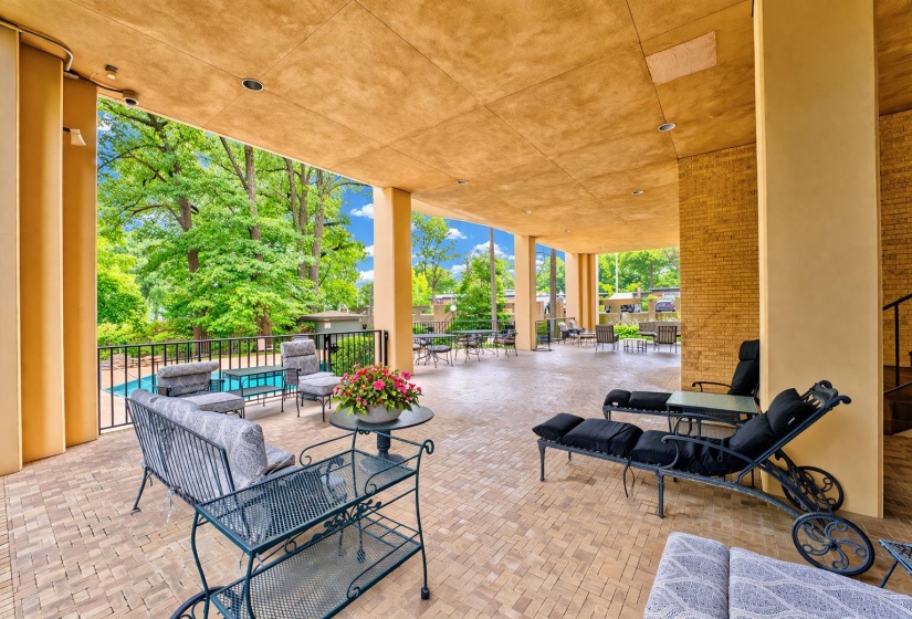 Relax in comfort beneath the covered patio, perfectly positioned to overlook the sparkling community pool. This inviting space offers a cool, shaded escape on sunny days—ideal for lounging with a cold drink, catching up with friends, or enjoying the view.