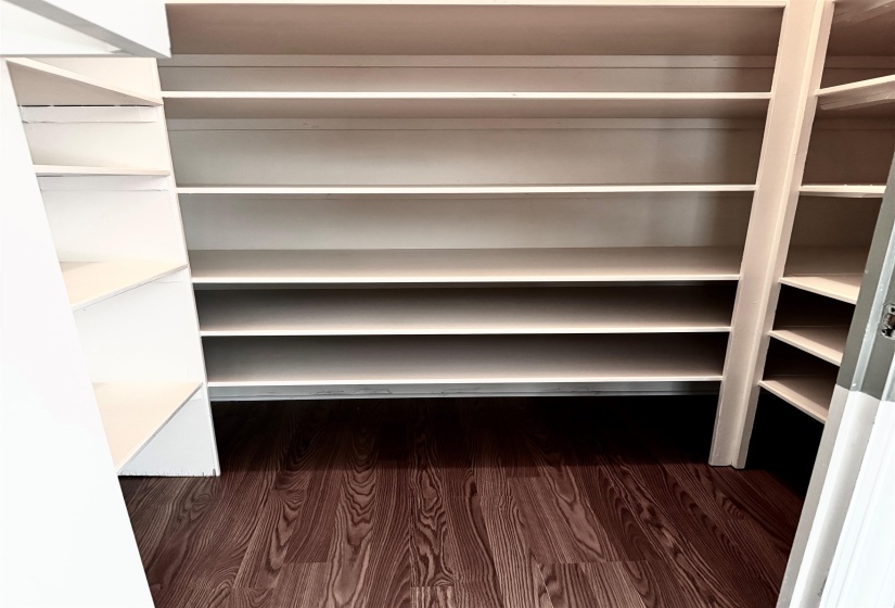 The dining room has a walk-in closet with shelving that is great for storage for silver.