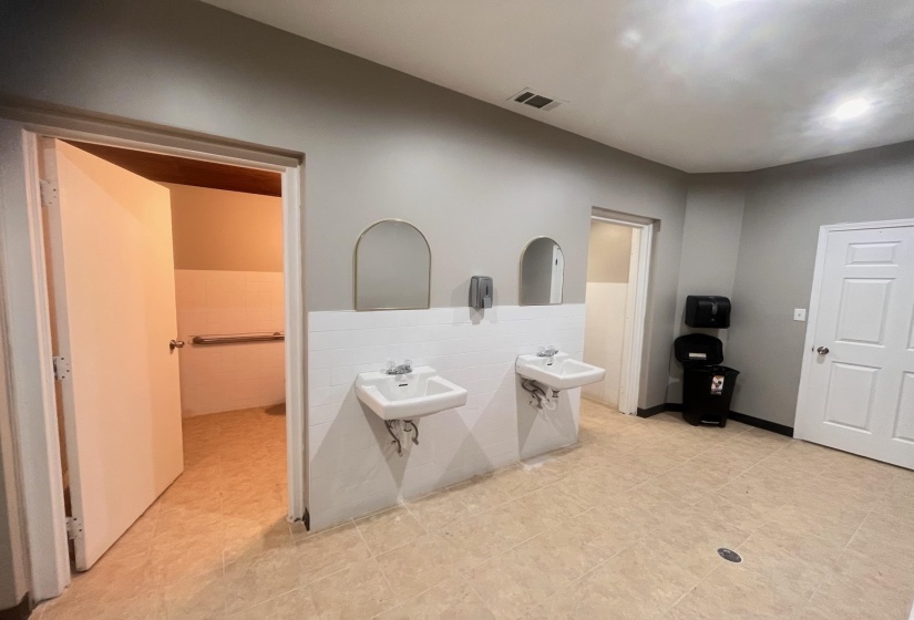 Bathroom featuring tile walls and wainscoting
