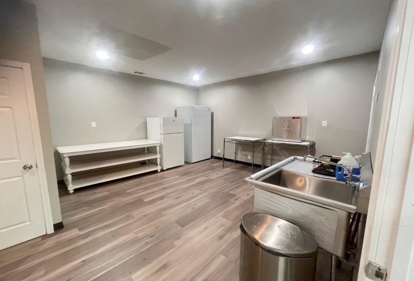 Kitchen featuring freestanding refrigerator, light wood-style floors, and recessed lighting
