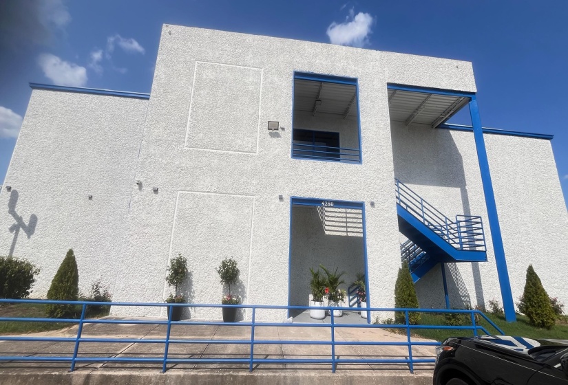 View of side of property featuring stucco siding