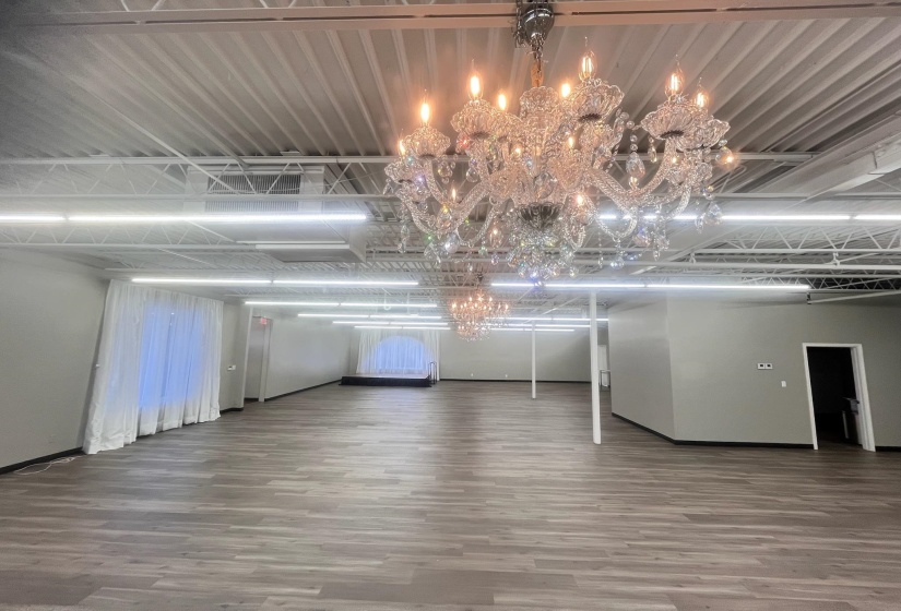 Interior space featuring a chandelier and wood finished floors