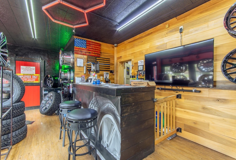 Bar with wood walls and wood finished floors