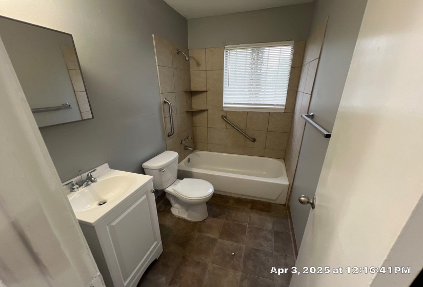 Full bathroom with bathing tub / shower combination and vanity