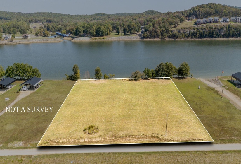 View of property location featuring a large body of water and property boundaries highlighted