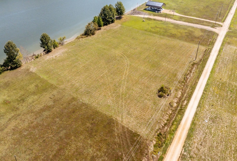 Aerial view of sparsely populated area featuring a large body of water