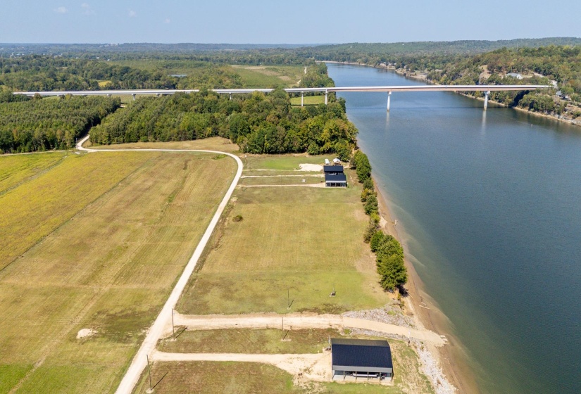 Drone / aerial view of a large body of water and a notable bridge
