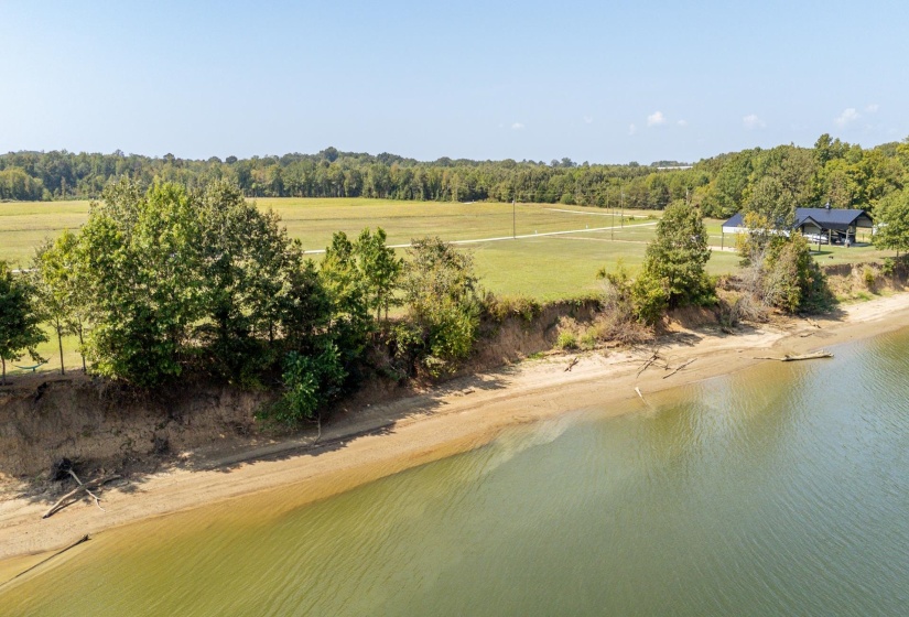 Aerial view of sparsely populated area featuring a large body of water