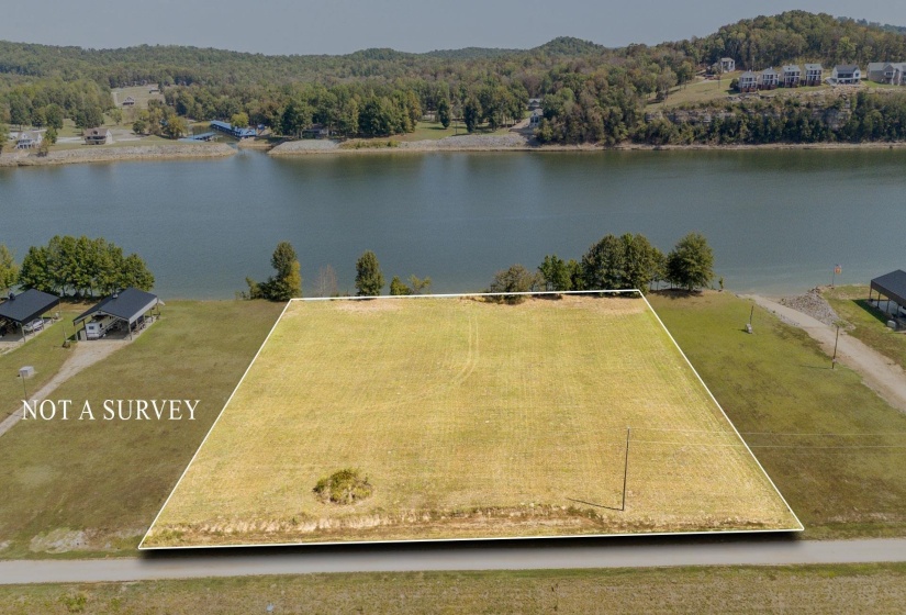 View of property location featuring a large body of water and property boundaries highlighted