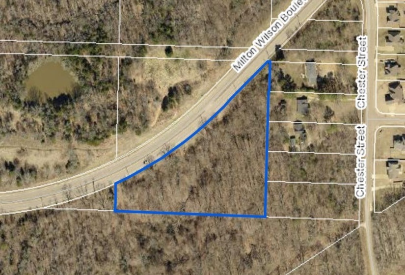 Aerial overview of property's location with property parcel outlined