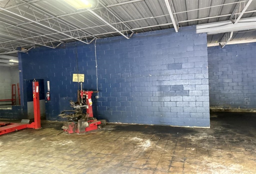 Misc room featuring concrete block wall