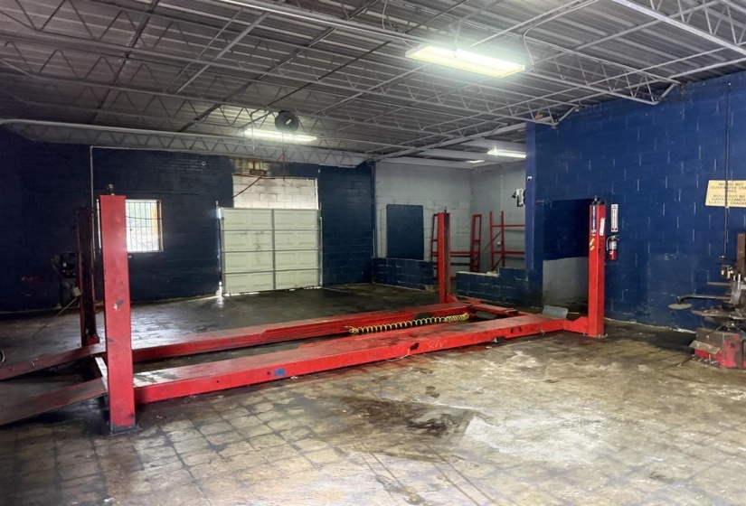 Garage featuring concrete block wall