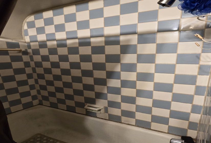 Full bath featuring shower / bath combination