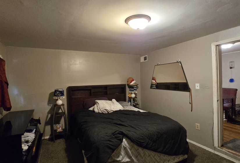 Bedroom with carpet flooring and baseboards