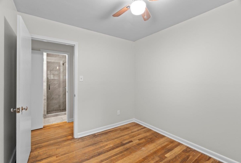 Spare room featuring light wood-type flooring and ceiling fan