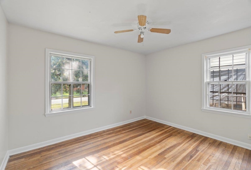 Unfurnished room with light wood-type flooring and a ceiling fan
