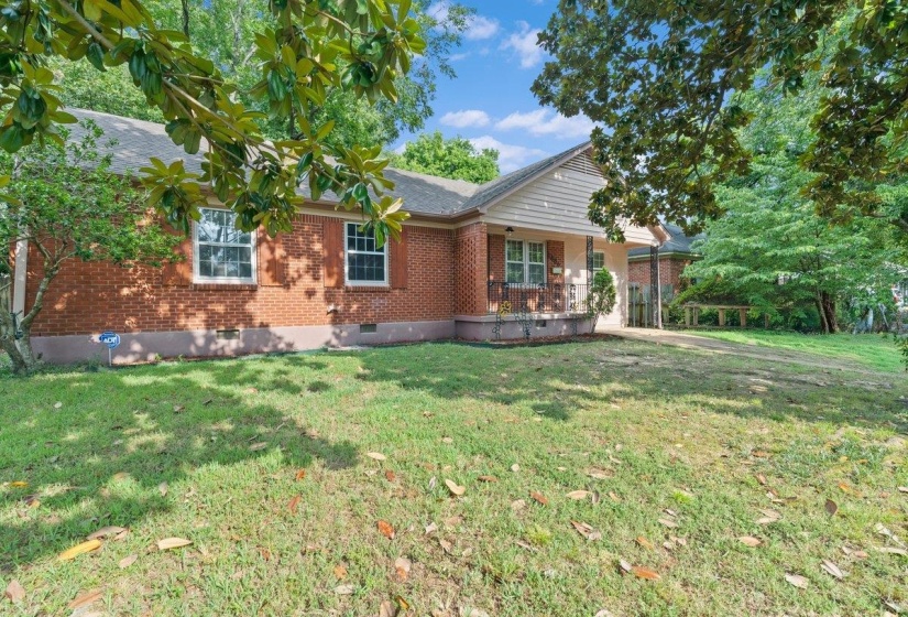 Single story home with crawl space, brick siding, and a front yard
