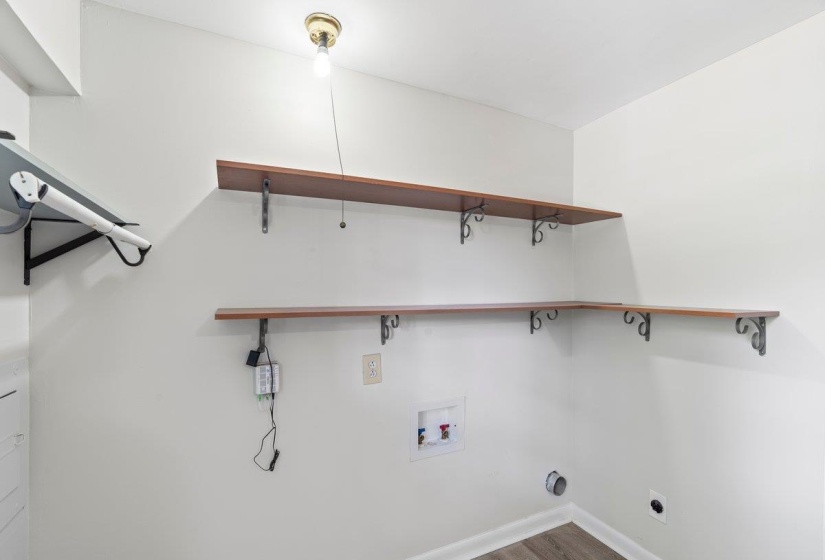 Laundry area featuring washer hookup, wood finished floors, and electric dryer hookup