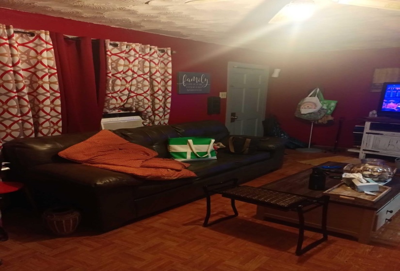 Living room featuring a textured ceiling
