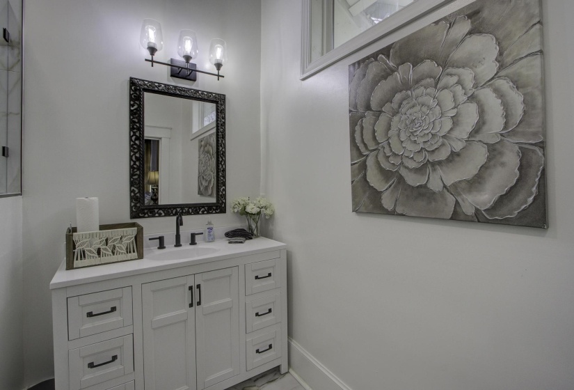 Bathroom featuring vanity and baseboards
