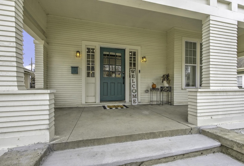 View of exterior entry featuring covered porch