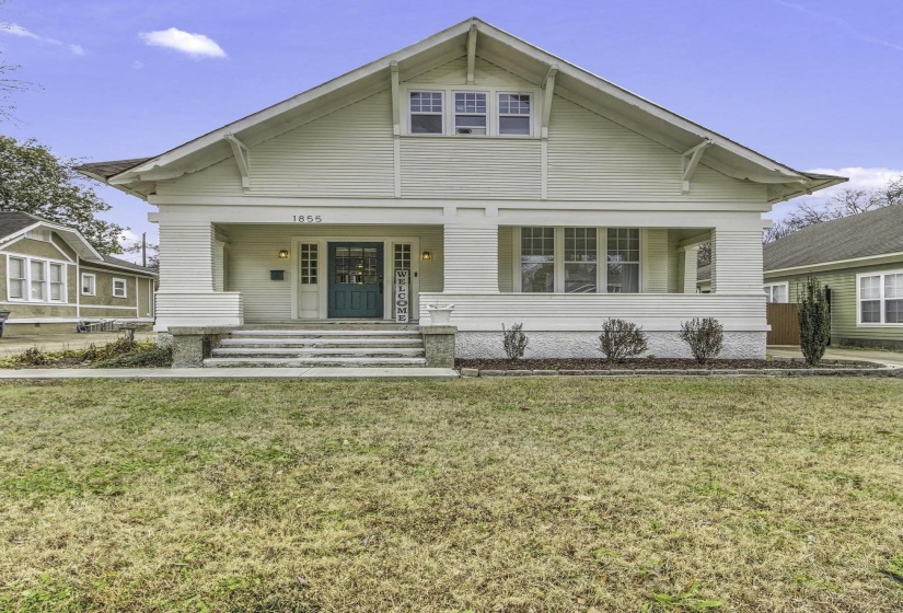 Bungalow-style home featuring a porch and a front lawn