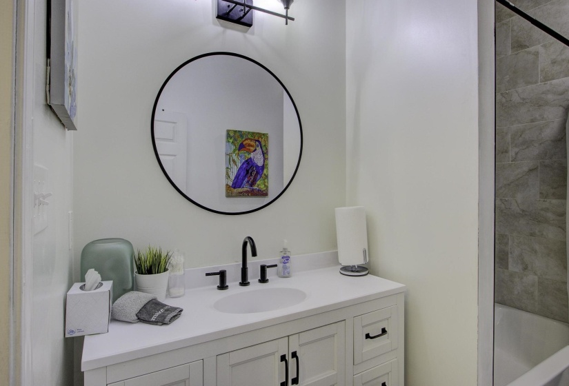 Bathroom with vanity and shower / bath combination