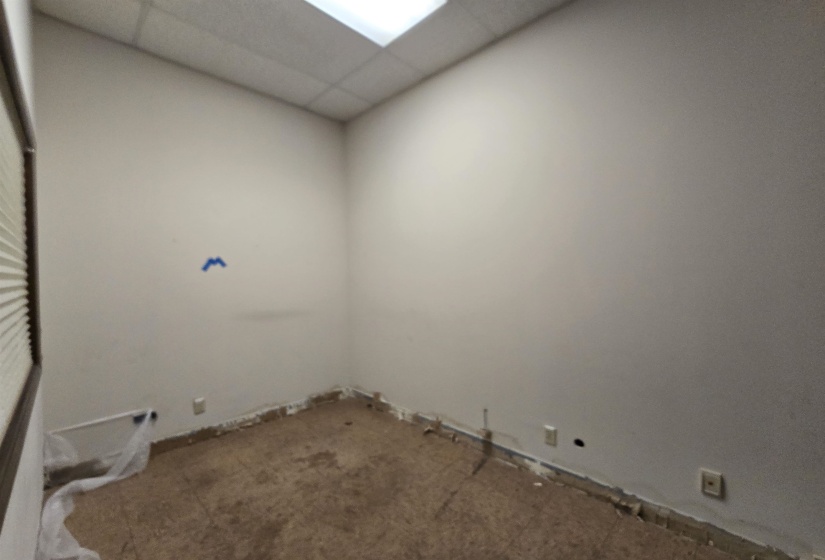 Empty room featuring a paneled ceiling