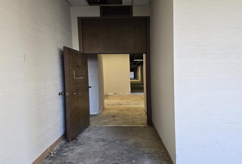 Corridor with unfinished concrete floors