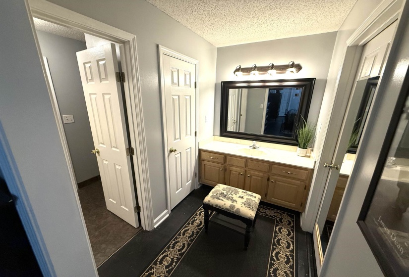 Bathroom featuring vanity and a textured ceiling