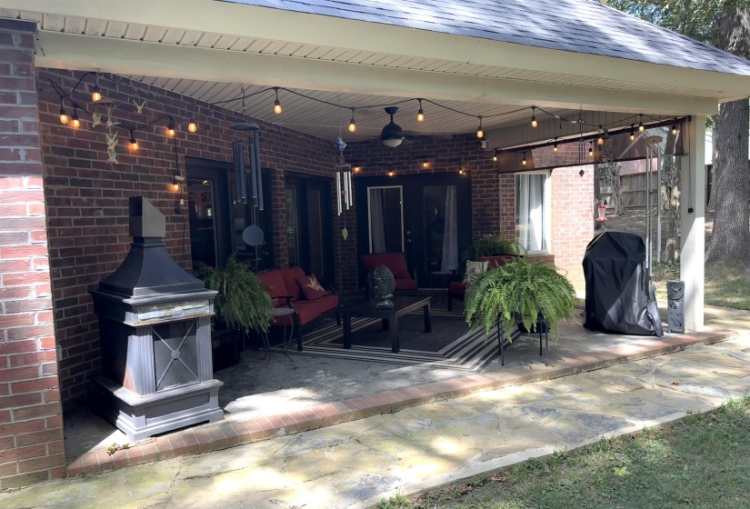 View of patio / terrace with grilling area, a ceiling fan, and an outdoor living space