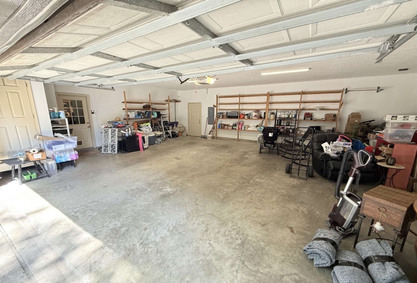 Garage with a garage door opener and electric panel