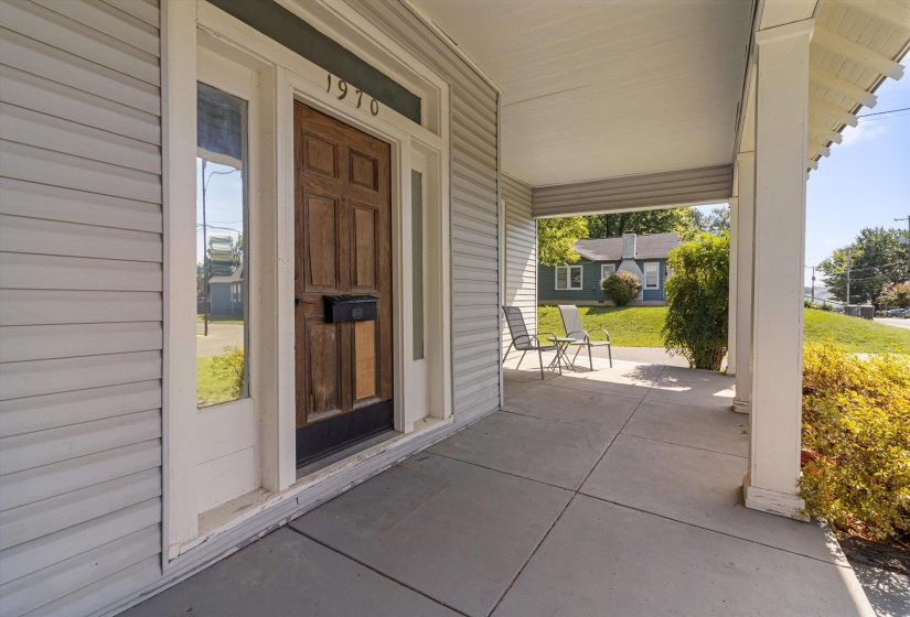 View of exterior entry with covered porch