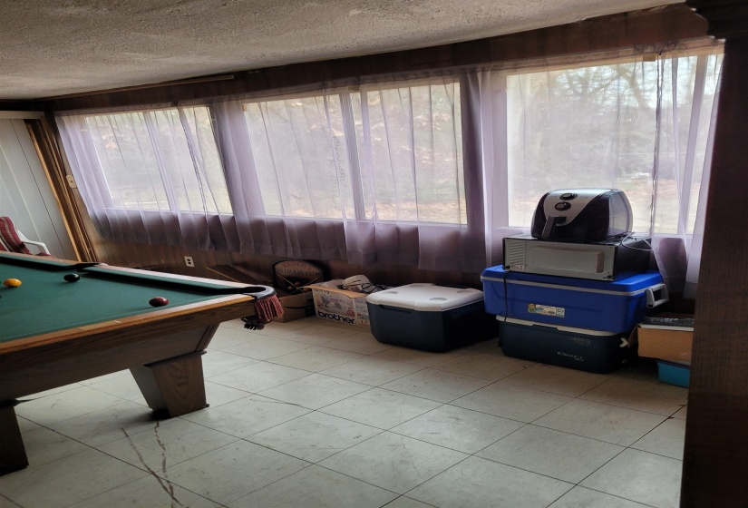 Game room with pool table and a textured ceiling
