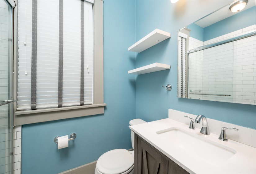 Bathroom with vanity and a shower stall