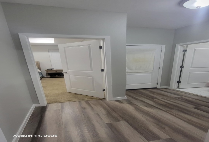 Hall featuring baseboards and light wood finished floors