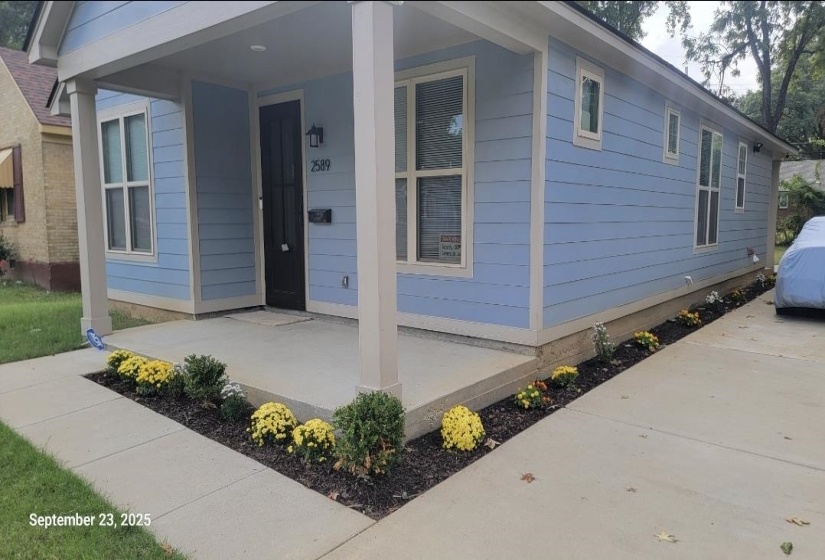 Doorway to property with covered porch