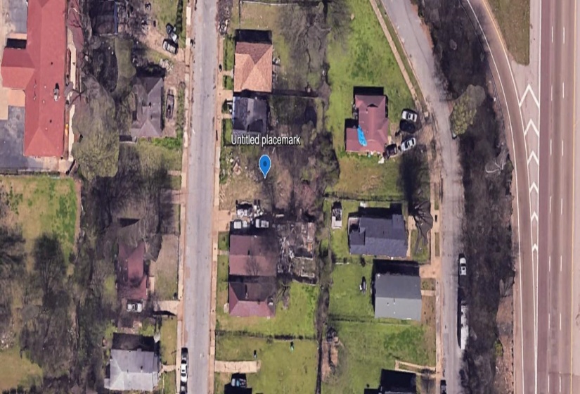 Aerial overview of property's location with nearby suburban area